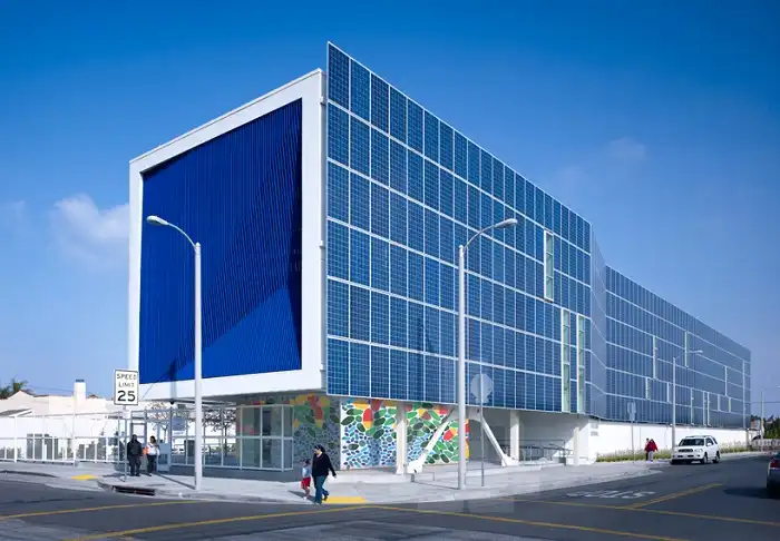 An office building featuring vertical solar panel window awnings